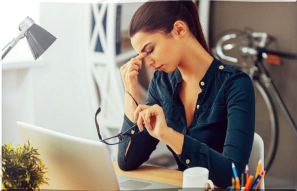 Woman at work with tired expression from ketogenic diet