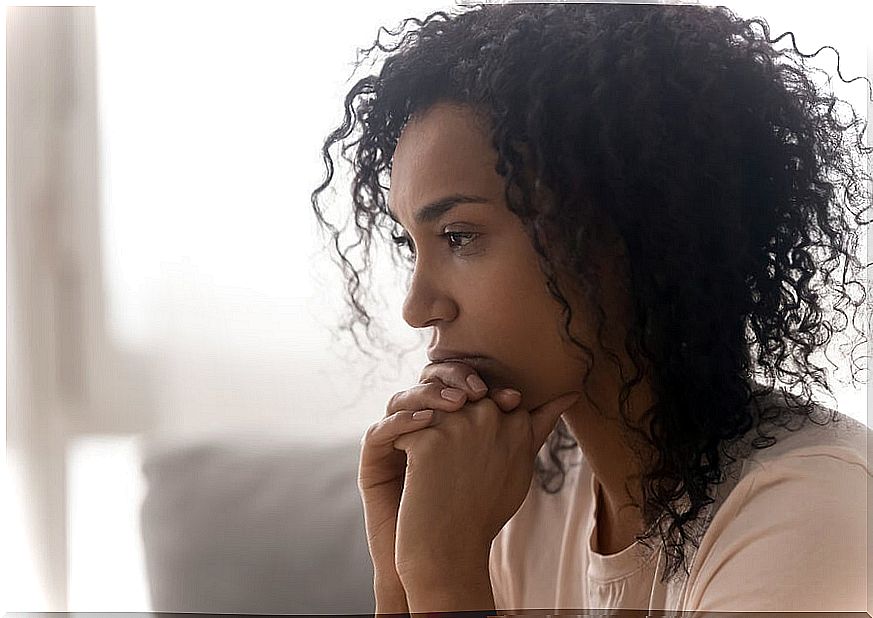 Pensive woman in a bad mood because of accumulated negative energies.