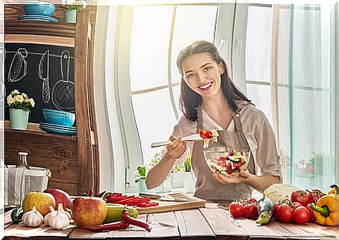 Woman in kitchen chopping vegetables to boost memory