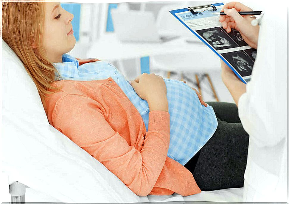 Pregnant woman at the doctor getting an ultrasound.