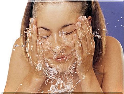 Woman washing her face