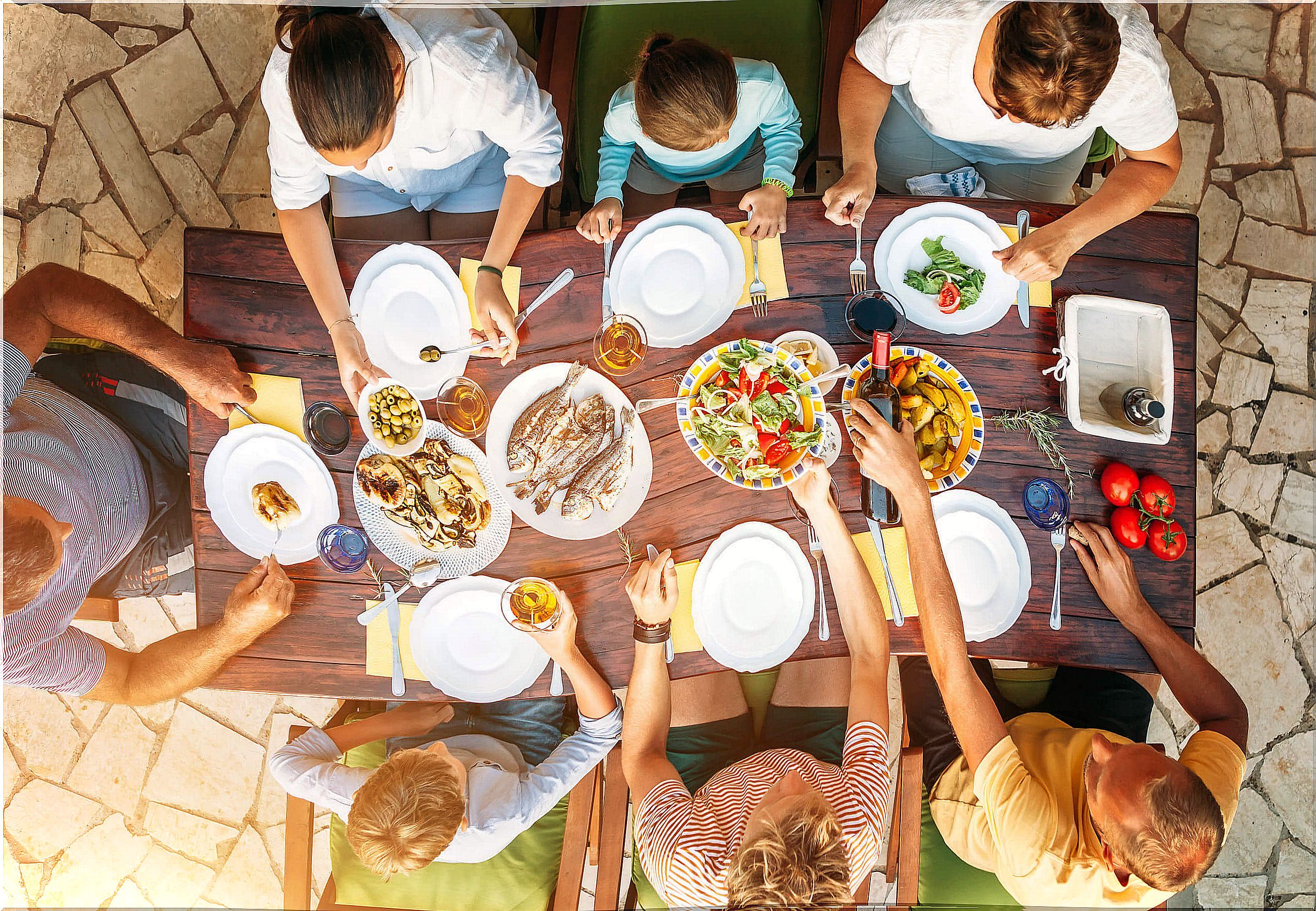 Happy families often get together to eat.