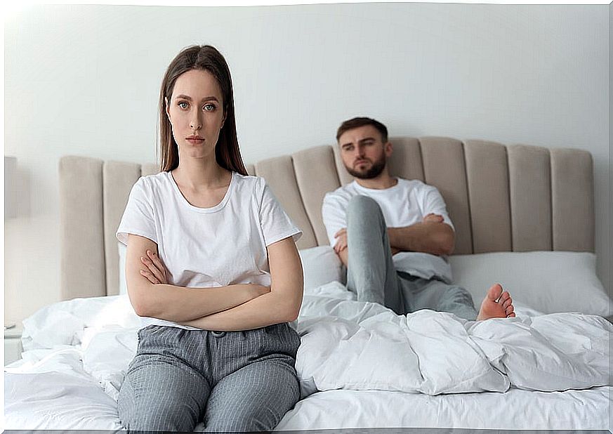 Troubled couple quarreled in bed.