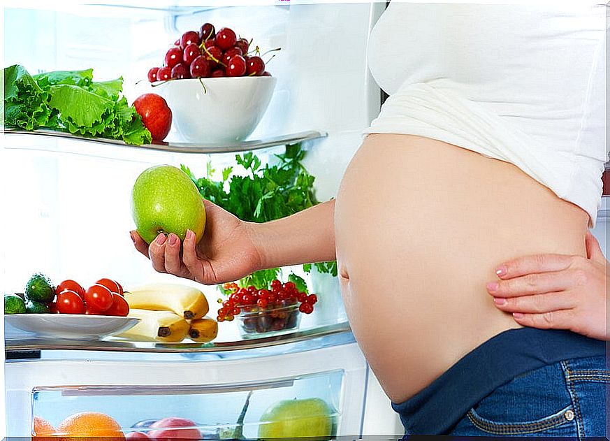 Pregnant in fridge with fruit