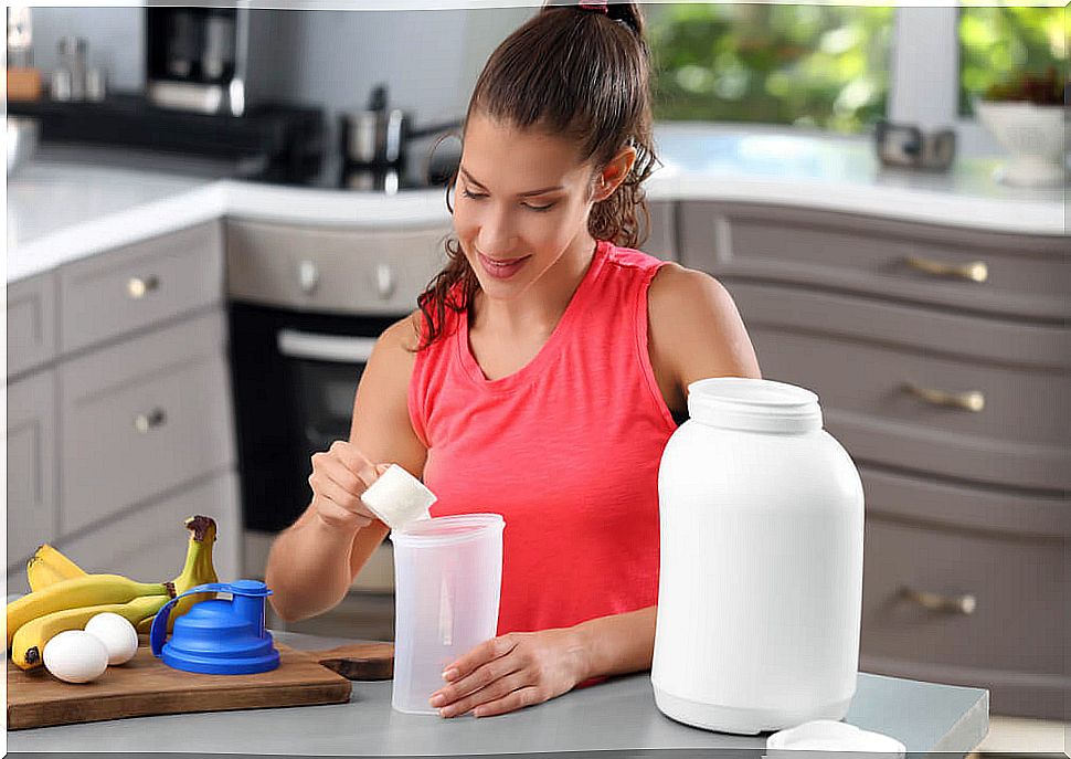 woman making protein shake