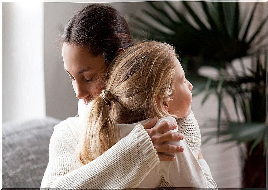 A hug between mother and daughter.