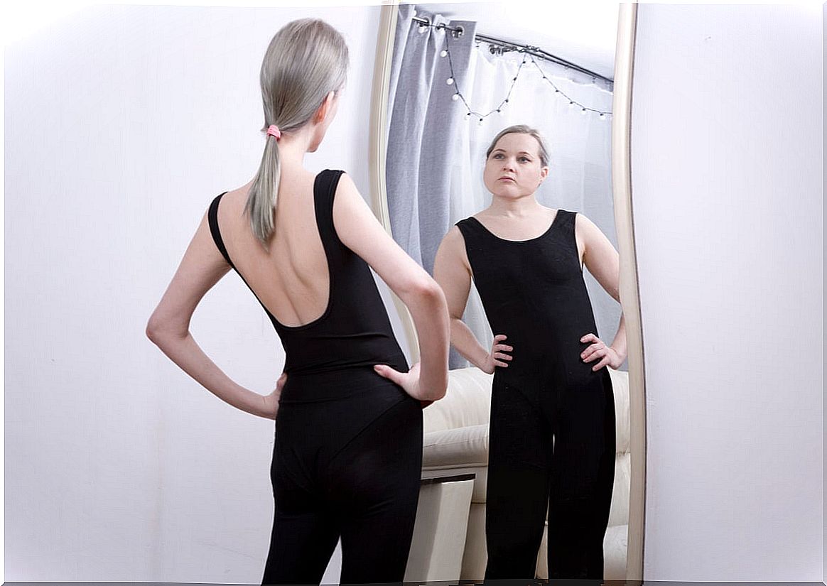 Woman in front of the mirror.